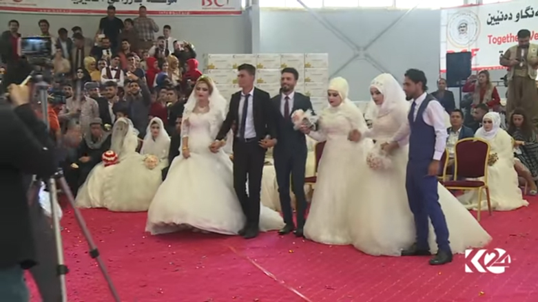 بالصور.. اربيل تحتضن عرسا جماعيا لـ 214 شابا وشابة